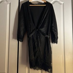 Hotouch women’s all black silk robe with lace trimming.